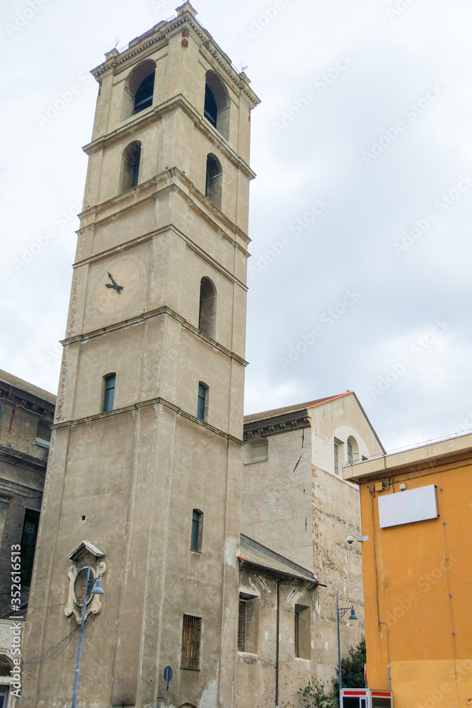 Medieval bell tower and facade of the cathedral in the old town of Savona, Liguria, Italy
