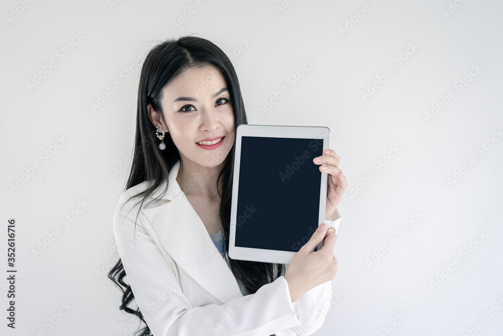 Business woman holding tablet with blank empty screen for us as mock up image for advertising and text. Business woman holding tablet with blank empty screen for us as mock up image for advertising and text.