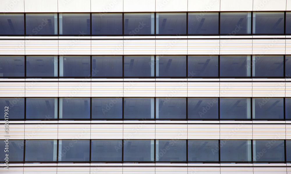 Modern office building with blue glass windows Modern office building with blue glass windows