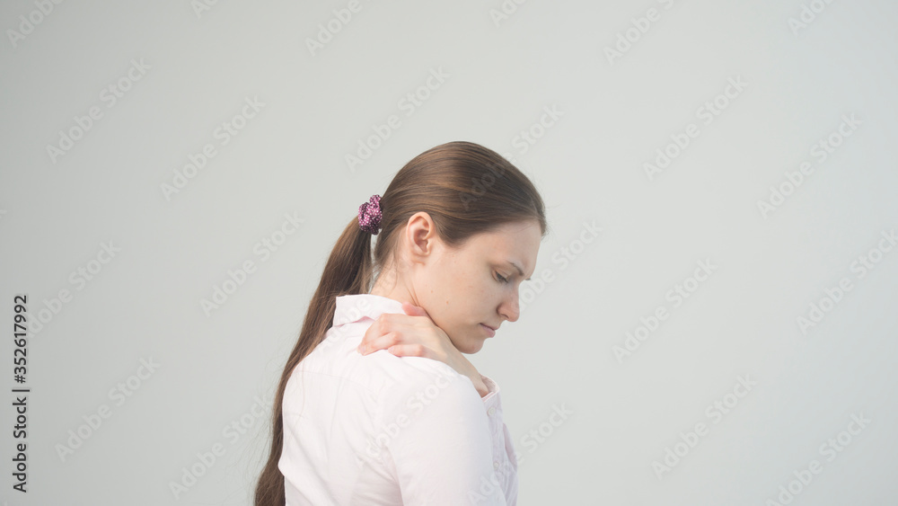 Tired woman feeling pain, massaging tense muscles Tired woman feeling pain, massaging tense muscles