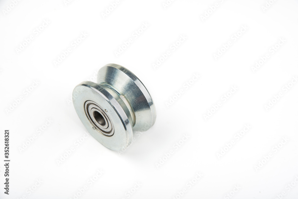 Heavy duty sliding wheel on bearings on a white Heavy duty sliding wheel on bearings on a white