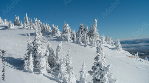 Scenic view of snow covered mountainside at ski resort, Sun Peaks Resort, Sun Peaks, British Columbia, Canada