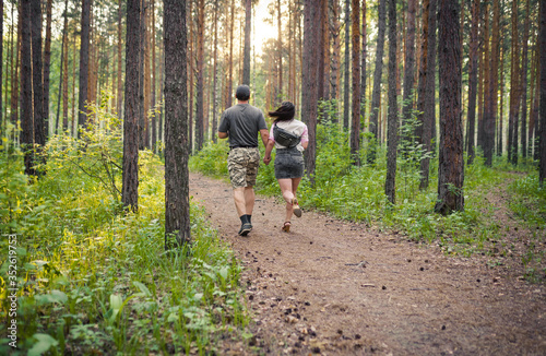 couple walking in the forest