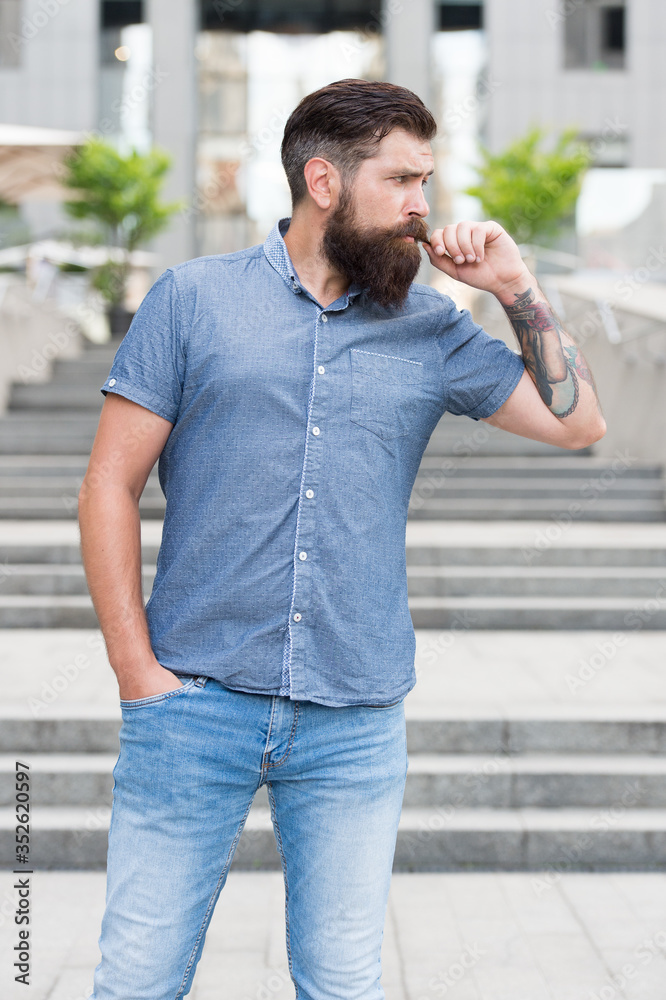 Your inner hipster. Hipster twirl mustache urban outdoor. Bearded