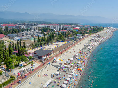 Beach and promenade from above, buildings construction and hotels