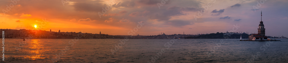 Maiden's tower in Istanbul, panoramic sunset on turkish coastline.