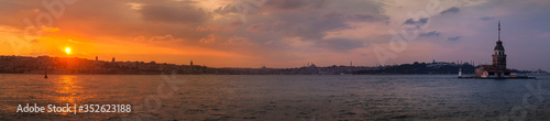 Maiden's tower in Istanbul, panoramic sunset on turkish coastline.