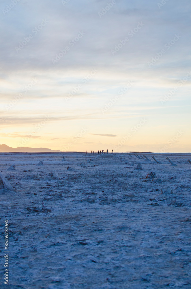 A long view of the empty and plain landscape of the great salt lake basin in the dusk sunlight. A long view of the empty and plain landscape of the great salt lake basin in the dusk sunlight.