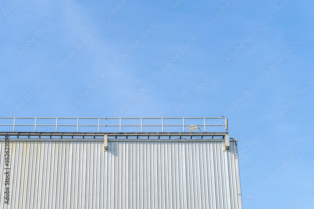 Some parts of the warehouse and blue sky background and copy space