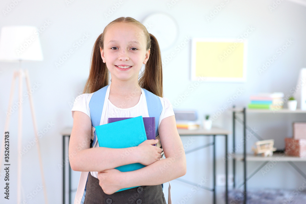 Lovely schoolgirl with a backpack in the interior of a bright room. Back to school. Getting ready for school. School Backpack Day
Lovely schoolgirl with a backpack in the interior of a bright room. Back to school. Getting ready for school. School Backpack Day