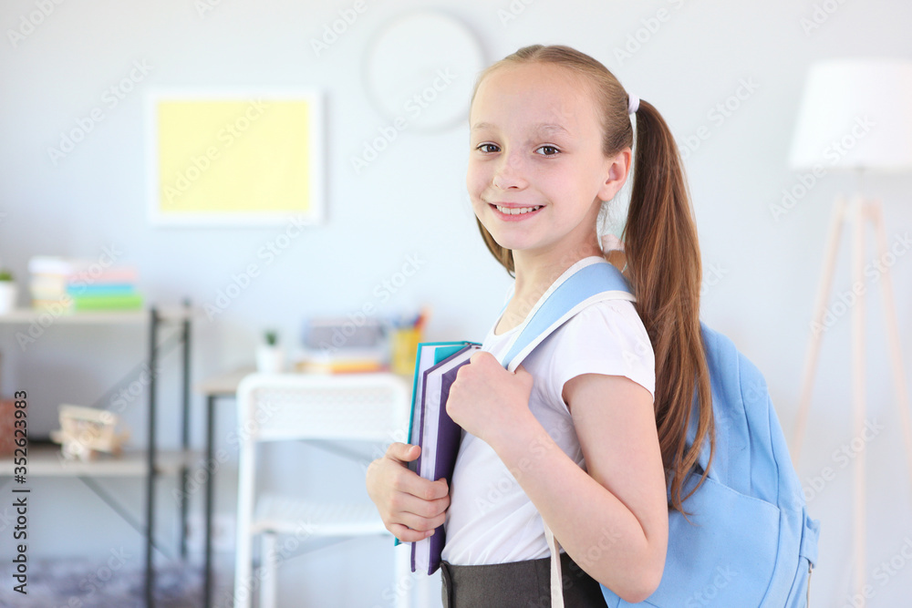 Lovely schoolgirl with a backpack in the interior of a bright room. Back to school. Getting ready for school. School Backpack Day
Lovely schoolgirl with a backpack in the interior of a bright room. Back to school. Getting ready for school. School Backpack Day
