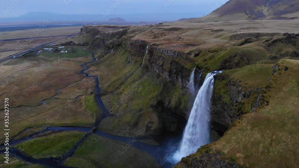 Waterfalls in green mountainous terrain Waterfalls in green mountainous terrain