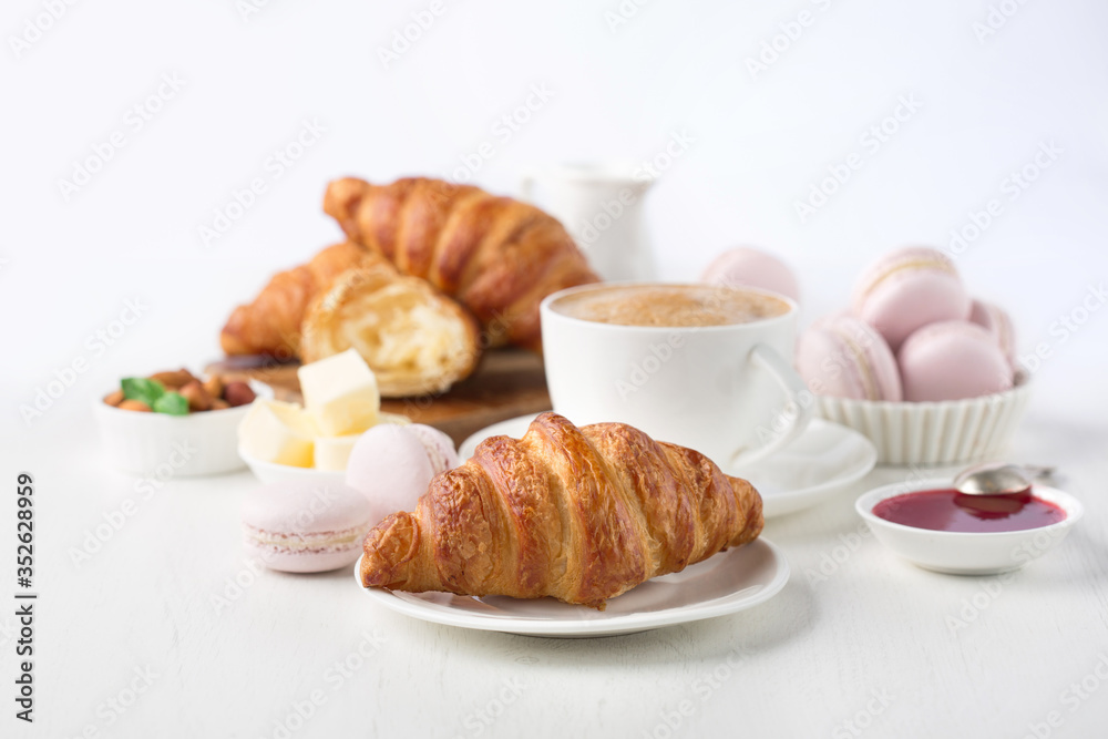 Fresh delicious breakfast with coffee and croissants Fresh delicious breakfast with coffee and croissants