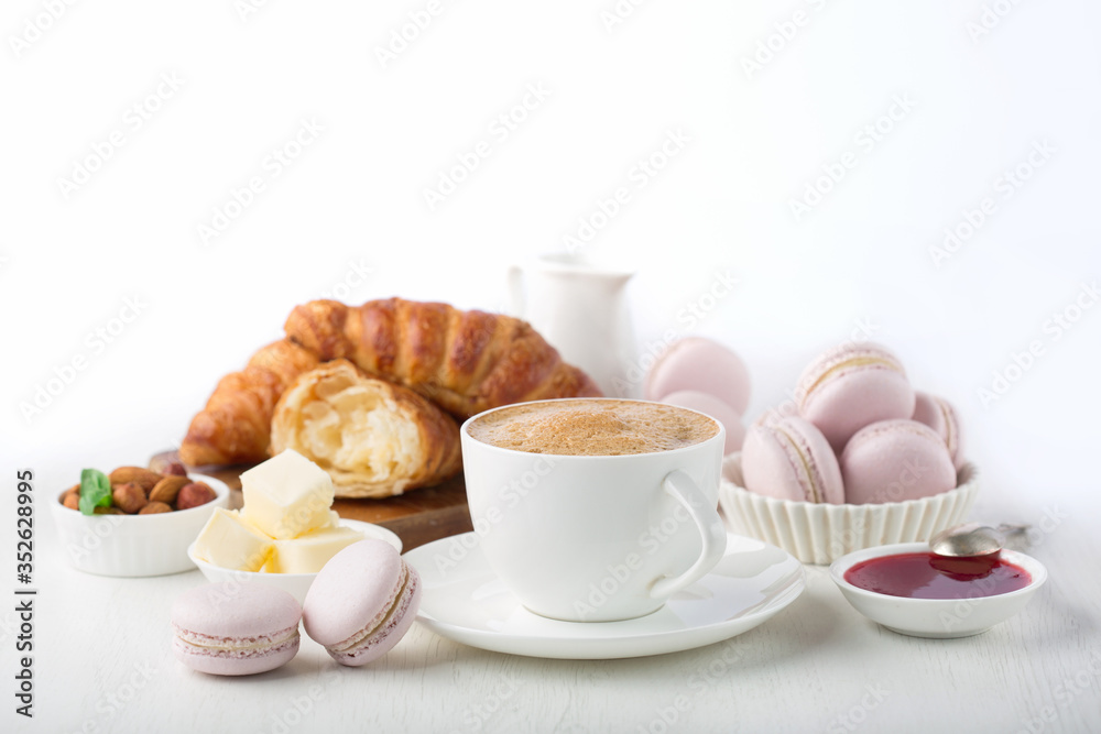 Fresh delicious breakfast with coffee and croissants Fresh delicious breakfast with coffee and croissants