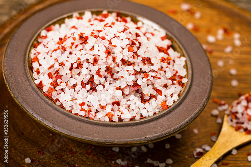 Chili Spicy Sea Salt on Wooden Background. Selective focus.