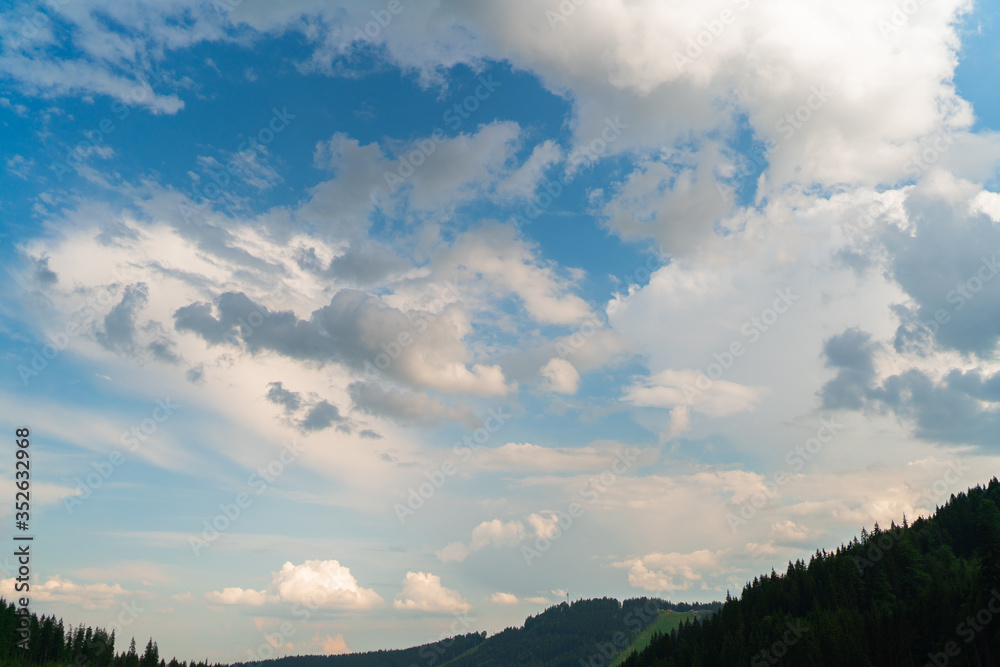 Summer landscape in mountains and the dark blue sky with clouds. Carpathians, Ukraine. Journey in the mountains. Hiking Travel Lifestyle concept beautiful mountains landscape on background.