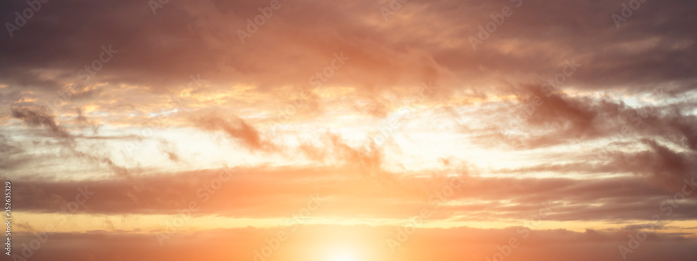 Evening sky with sun flare. Long poster or banner.
