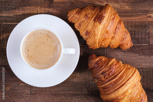 Directly above cap coffee cappuccino and two croissant
