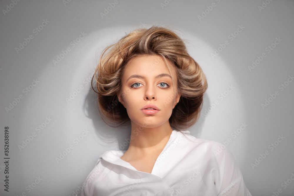The blonde with an interesting hairstyle and big blue eyes. The blonde with an interesting hairstyle and big blue eyes.