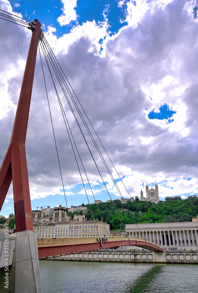Obraz premium The Basilica of Notre Dame de Fourviere overlooking Lyon, France and the Saone River.