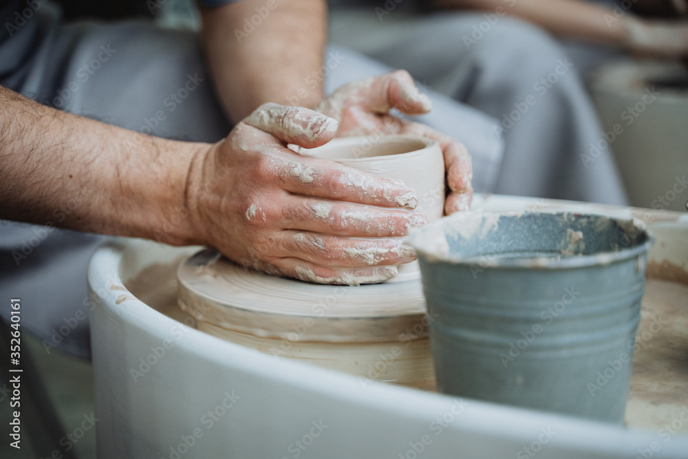 Potter's wheel, pottery workshop, working with clay, clay, clay modeling, modeling, ceramics, hands made of clay, clay pot, stained in clay, dirty hands, creativity, workshop, hands, planters