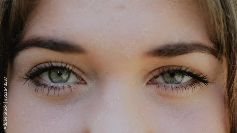 Close-Up of Young Woman’s Blinking Eyes, Slow Motion Macro Shot of Female Eyes Opening and Closing with Natural Long Eyelashes. Close-Up of Young Woman’s Blinking Eyes, Slow Motion Macro Shot of Female Eyes Opening and Closing with Natural Long Eyelashes.