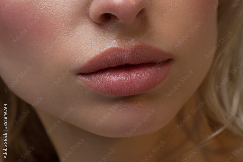 Sexual full lips. Natural gloss of lips and woman's skin. The mouth is  closed. Increase in lips, cosmetology. Natural lips. Great summer mood with  open eyes. fashion jewelry. Pink lip gloss Photos