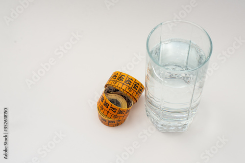 glass of water and measuring tape