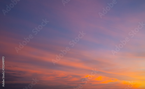Fototapeta Naklejka Na Ścianę i Meble -  Amazing purple and orange sky with dramatic clouds. Sunset on nature, background wallpaper.