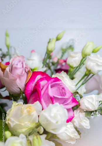 Beautiful bouquet of flowers on white background. Roses  eustoma and tulips. Stylish present for all holidays. Happy birthday gift. Mother s day postcard. Spring mood.