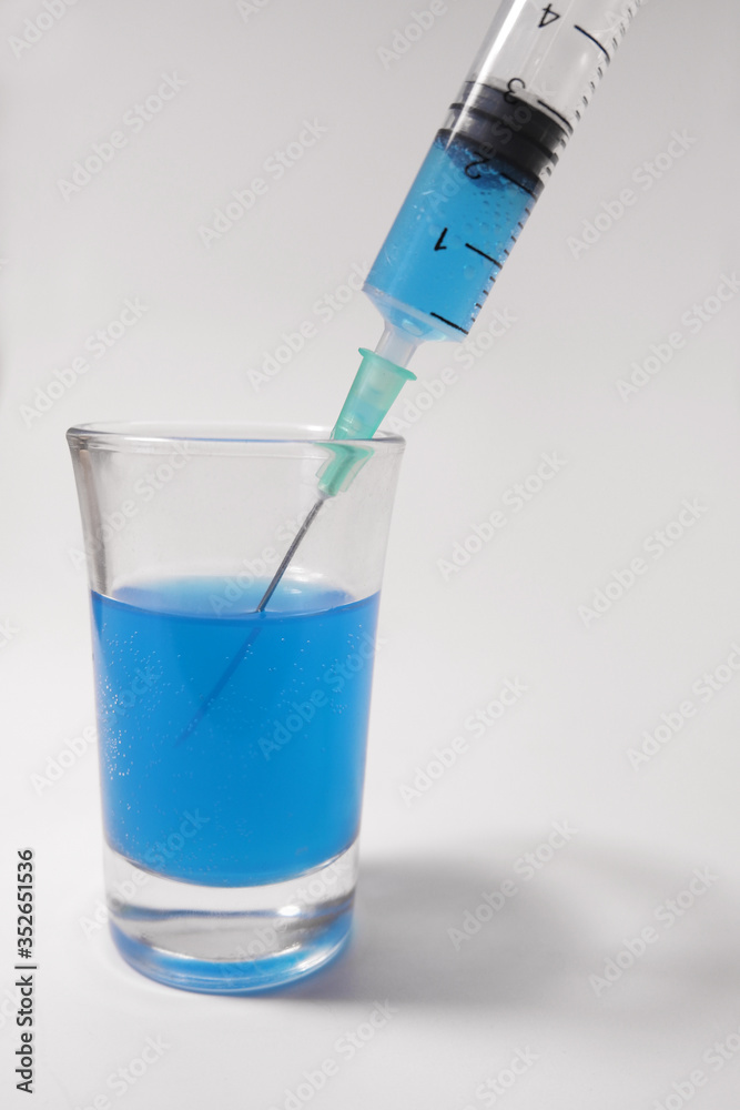 Injecting blue liquid	
