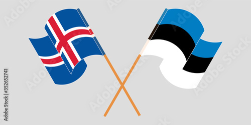 Crossed and waving flags of Iceland and Estonia