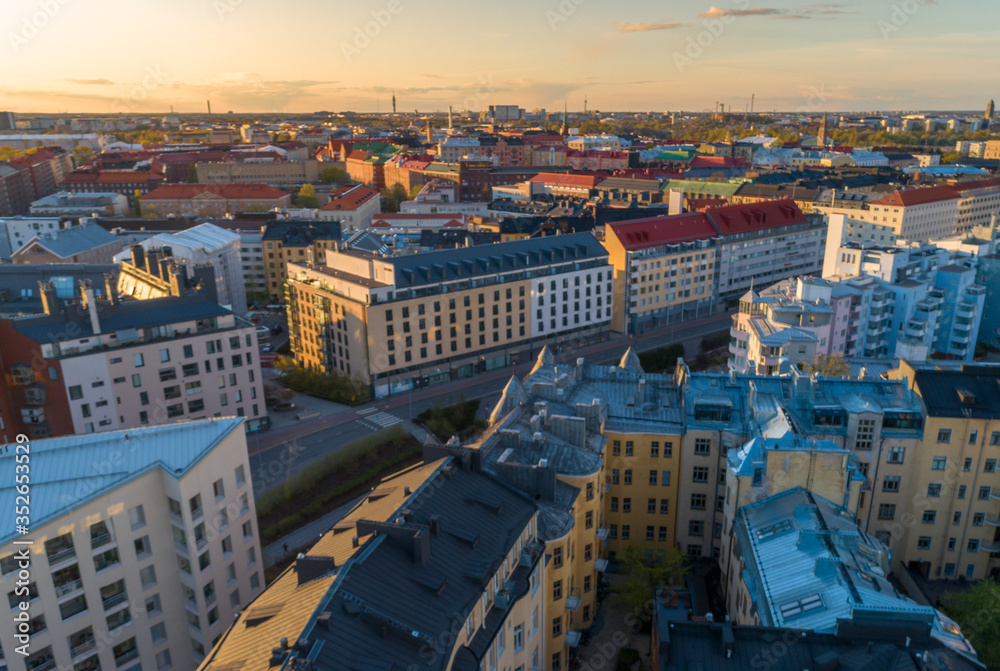 Aerial sunset view of beautiful city Helsinki . Colorful sky and colorful buildings. Helsinki, Finland.