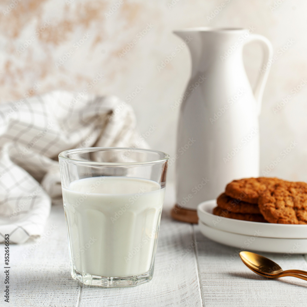 Glass of milk, jug, cookies. The concept of dairy products, the use of milk, farm products. Copy space. Square photo Glass of milk, jug, cookies. The concept of dairy products, the use of milk, farm products. Copy space. Square photo
