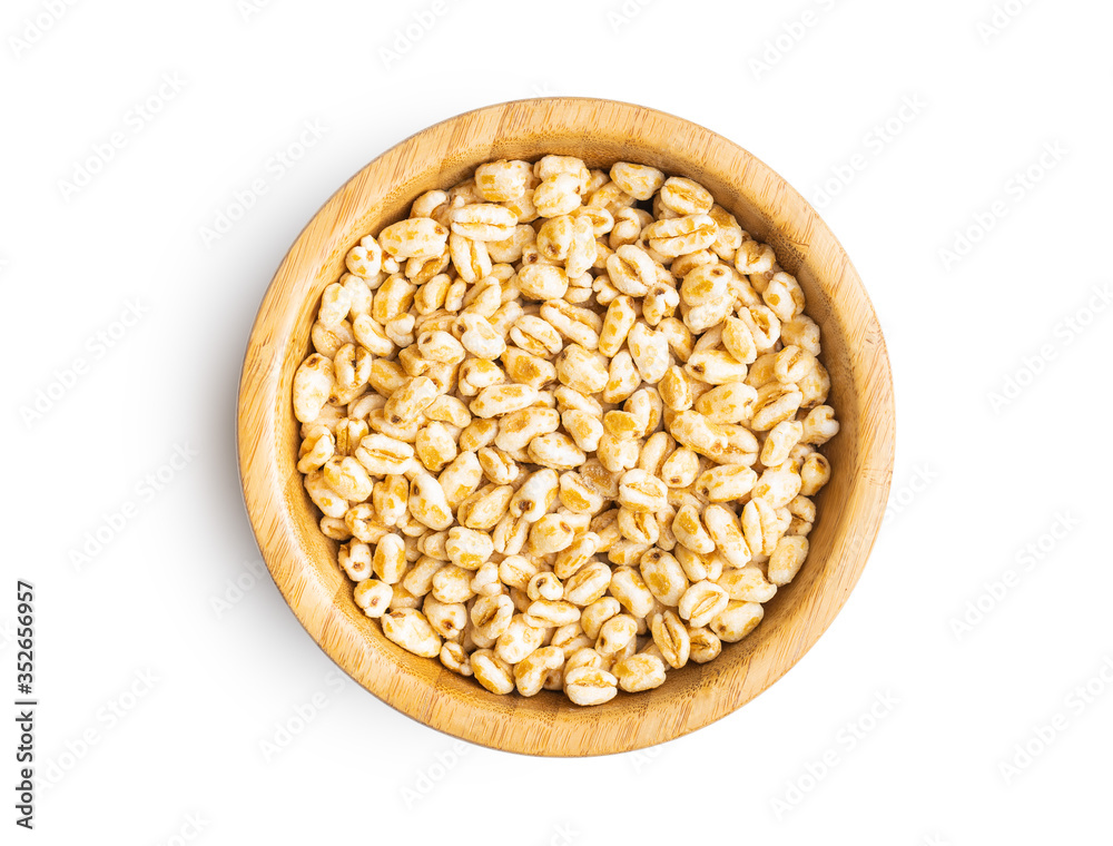 Puffed wheat covered with honey in bowl. Puffed wheat covered with honey in bowl.