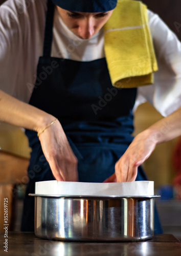 Cook hands preparing a kitchen mold
