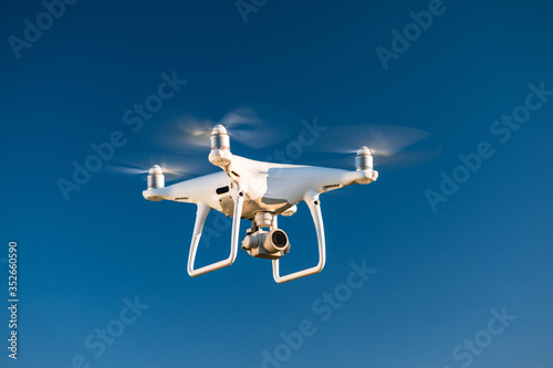 drone flying over the blue sky background