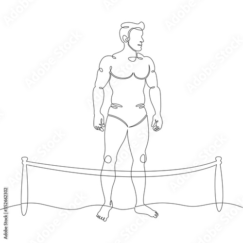 man tans, relaxing on the beach during a coronavirus pandemic, fenced beach