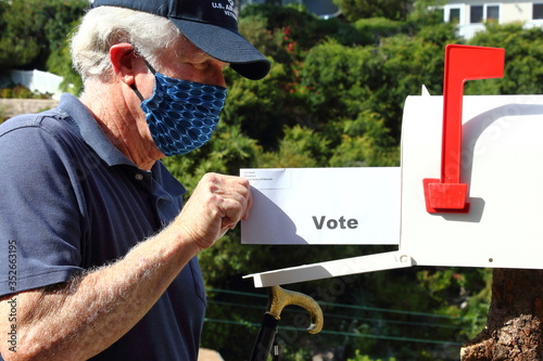 Elderly man voting by mail photo