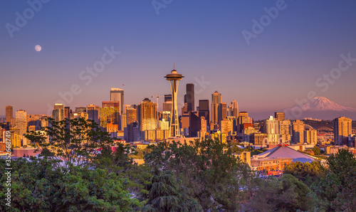 Seattle city skyline with Mt Rainier at sunset with urban office buildings viewed from Kerry Park.