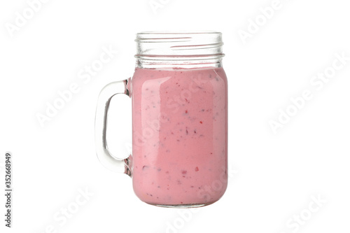 Glass jar with strawberry and raspberry milkshake isolated on white background