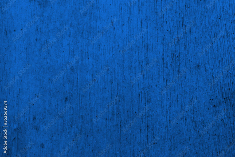 Blue background. Abstract blue background. Wood texture. Painted wood background.