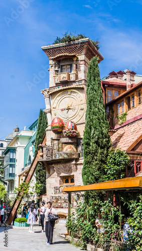 Falling Clock tower of puppet theater Rezo Gabriadze in old town of Tbilisi. Georgia photo