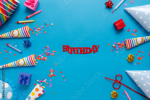 flatlay Birthday party card on a blue background with copy space for text.