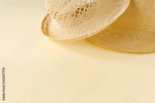 Beautiful straw hat  on the ocean coast . Nature summer background.