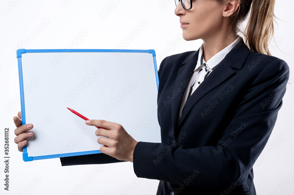Close-up: business woman in a suit with a tablet and marker. Business woman. Online education Close-up: business woman in a suit with a tablet and marker. Business woman. Online education