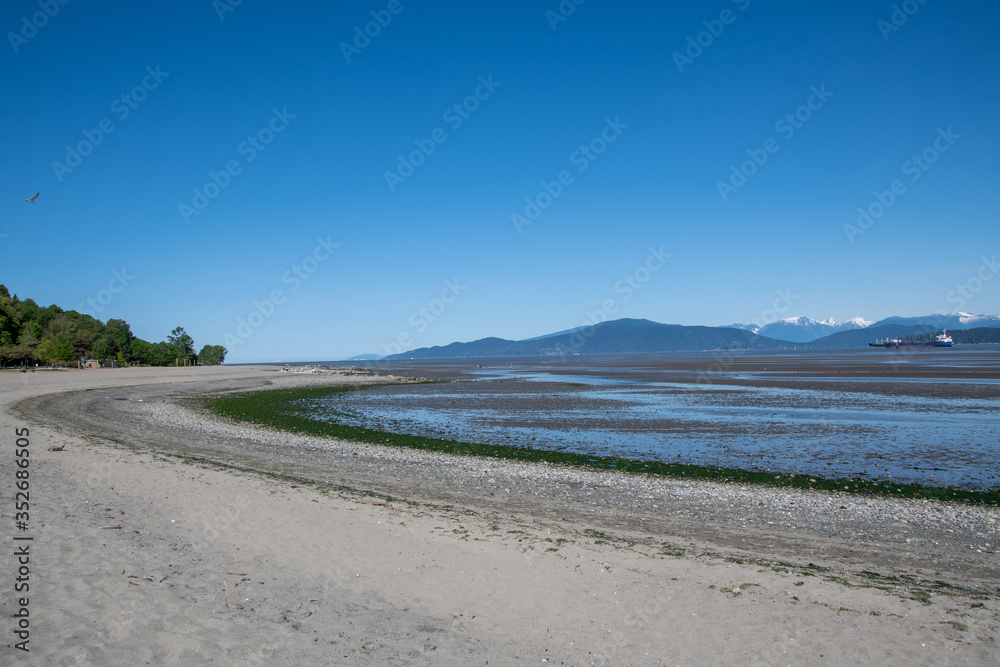 A shoreline of Spanish banks at low tide.      Vancouver BC Canada
