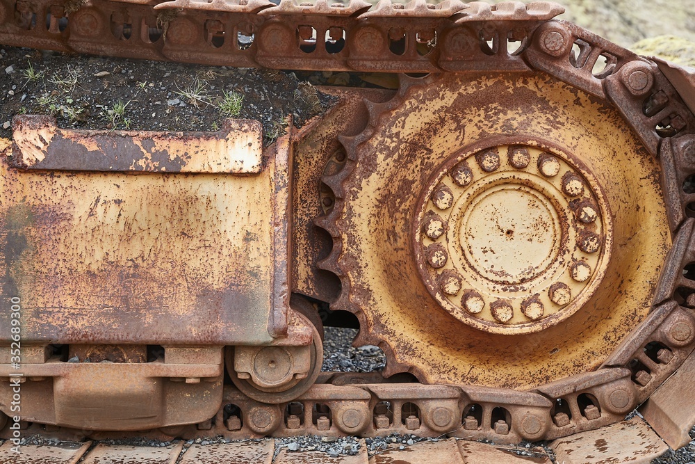 Old excavator rusting in a forest Old excavator rusting in a forest