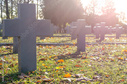 Grodno, Belarus, October 26, 2018: Large military cemetery. Many white large stone crosses. Polish flag. A modern well-kept memorial.
