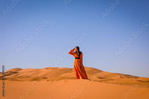 A girl in a beautiful Moroccan dress. Merzouga Morocco. photo